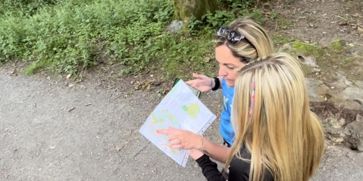 Two females looking at an orienteering map