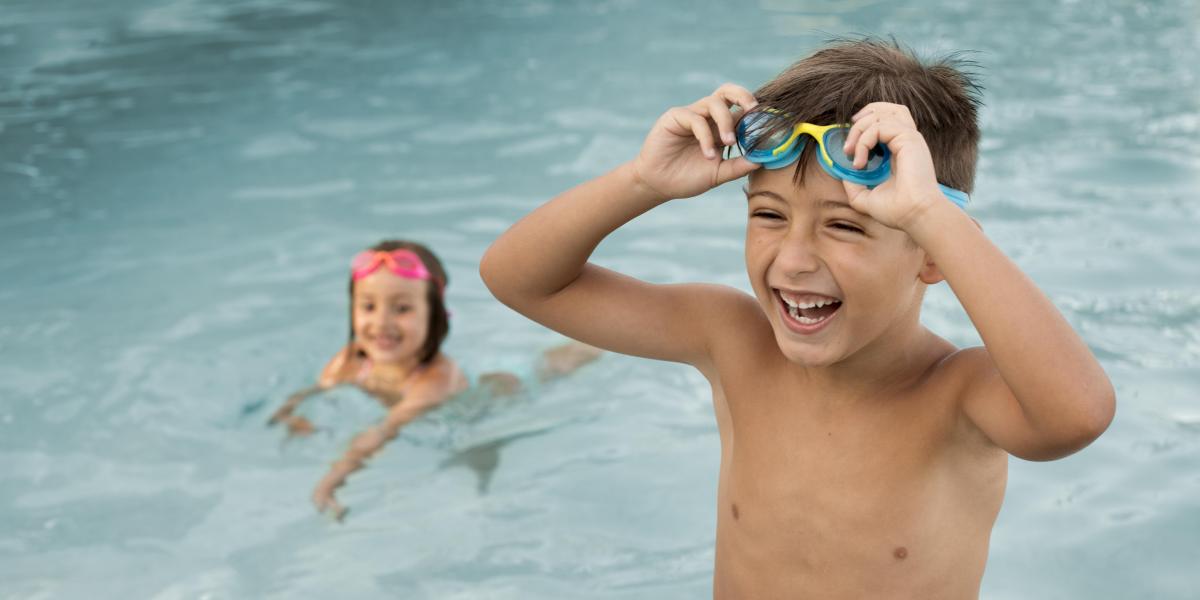 Boy and girl in swimming pool