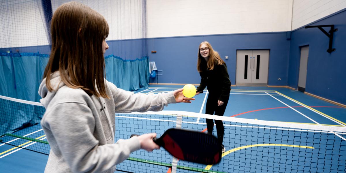 Girls playing pickleball