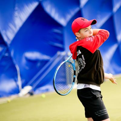 Boy playing Tennis in the Dome at Comber Leisure Centre